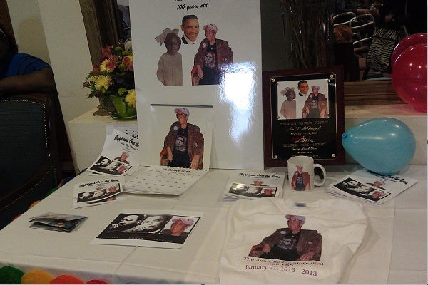 <p><p>A table filled with memorabilia honoring Ida McDougal and President Barack Obama's Inauguration Day. (Yasmein James/for NewsWorks)</p></p>
