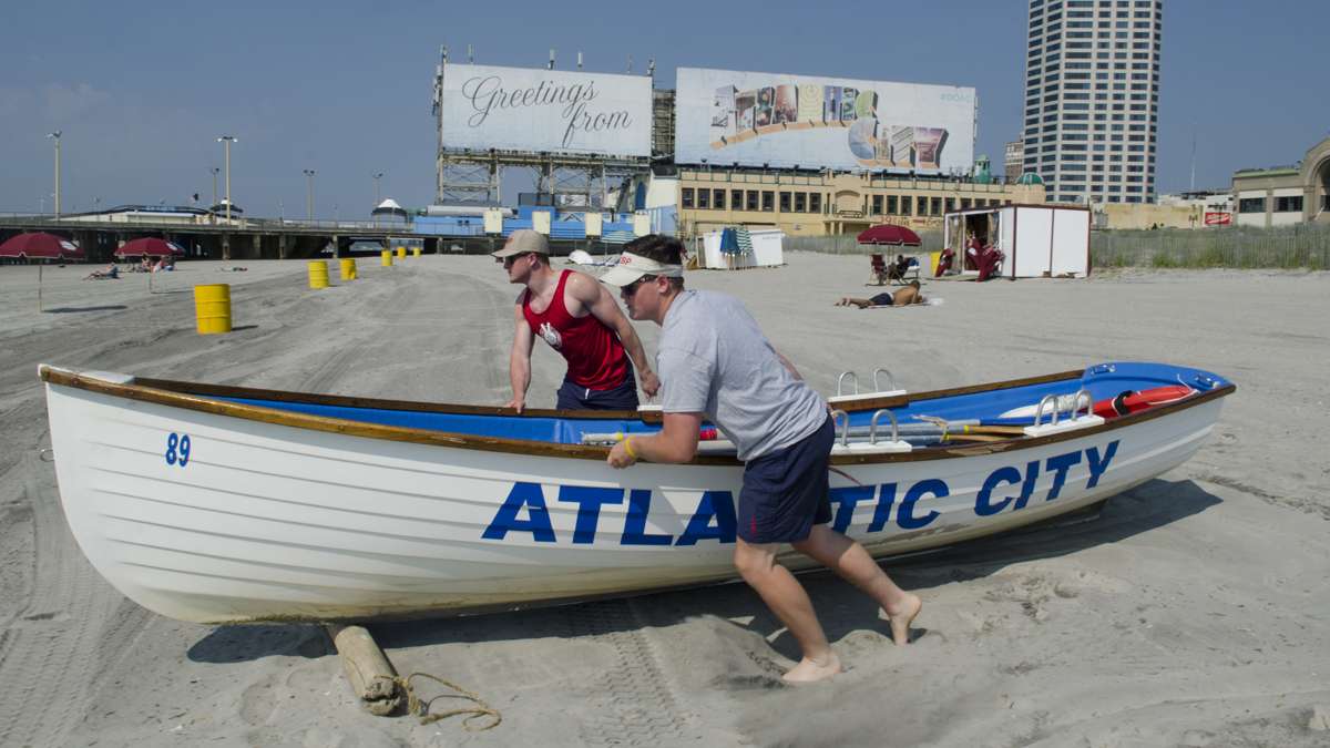 Atlantic City Beach Patrol Life Guards, Connor Maher and Andrew Light, ready a life boat at the South Carolina beach to start Memorial Day weekend, Saturday, May 28, 2016.