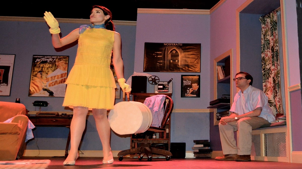meanex Nancy (Julia Wise) happily delivers bad news to former husband Allan Felix (James Lewis) in a scene from The Stagecrafters Theater’s production of “Play it Again, Sam.”