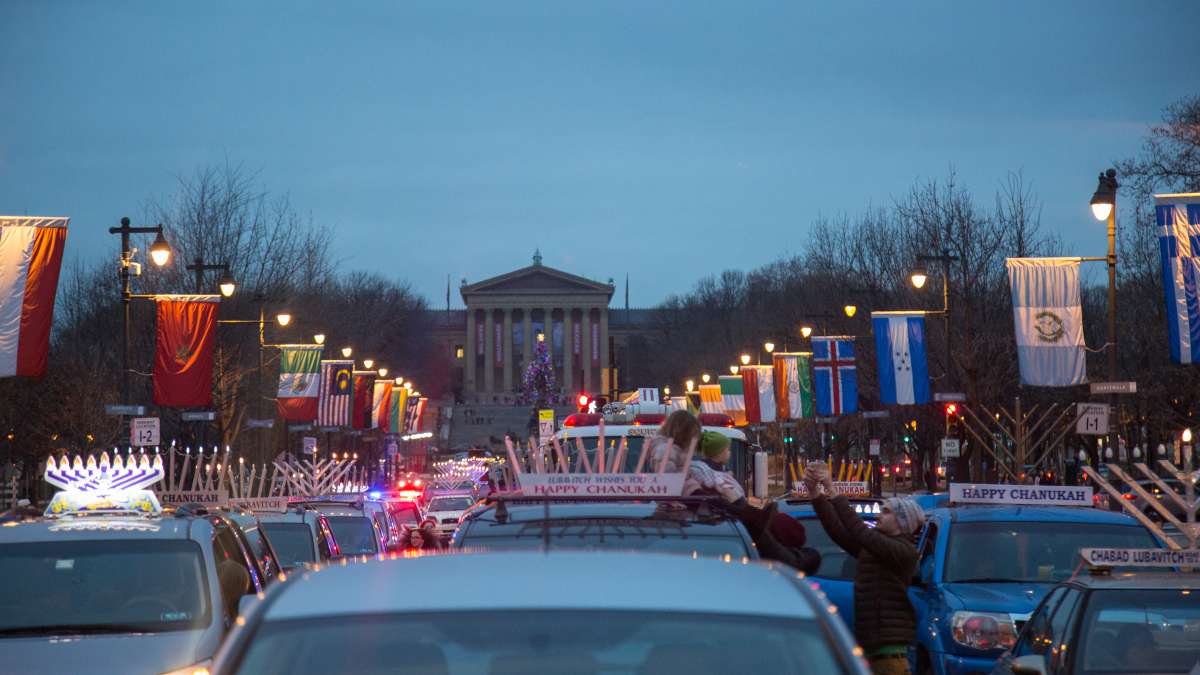 More than 250 cars gather on the Ben Franklin Parkway for the 10th Annual Car Menorah Parade December 26, 2016.