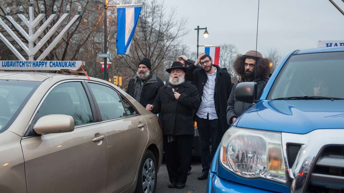 Rabbi Abraham Shemtov, the regional director of Lubavitch, leads a Maariv (evening prayer service) before the beginning of the 10th Annual Car Menorah Parade in Philadelphia on the third night of Hanukkah.