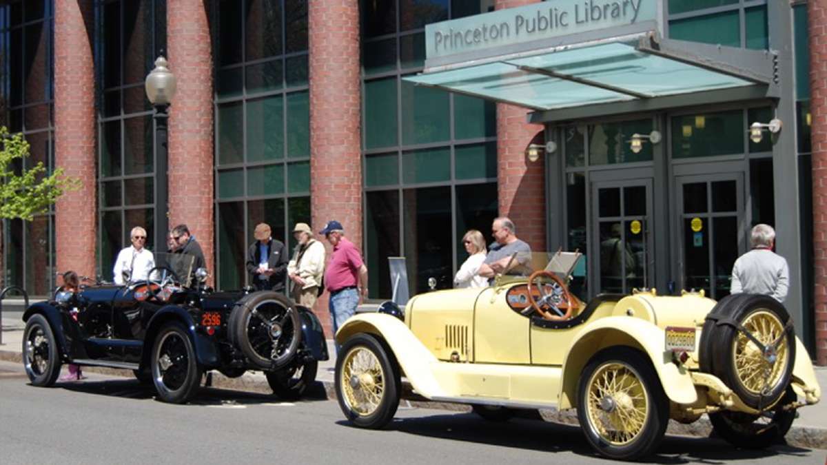 Two L-Head Mercer Raceabouts, canary yellow (1920) and black (1923), parked outside the Princeton Public Library.