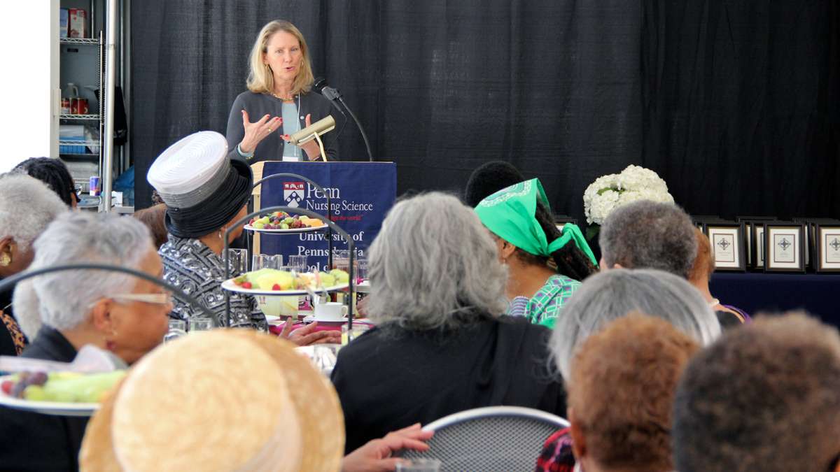 Julie A. Fairman, director of the Barbara Bates Center for the Study of the History of Nursing, speaks to alumni of Mercy Douglass School of Nursing during a recent tea at the University of Pennsylvania. (Emma Lee/for NewsWorks)