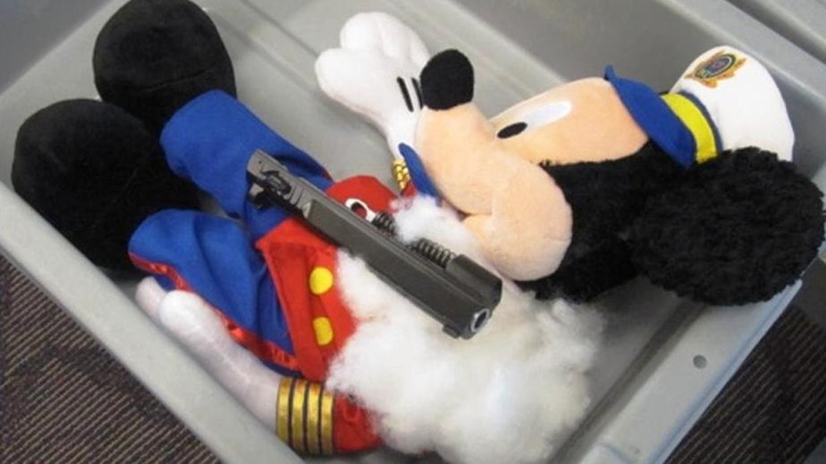  This undated photo provided by the federal Transportation Security Administration shows pistol parts hidden in a stuffed animal found inside a carry-on bag that was put through an x-ray machine as part of normal security screening at T.F. Green Airport in Warwick, R.I. (AP Photo/Transportation Security Administration)  