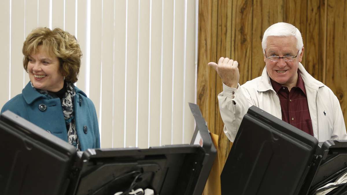 Pennsylvania Governor Tom Corbett jokes with photographers as he casts his vote in Shaler Township, Pa. on Tuesday, Nov. 4, 2014. (Keith Srakocic/AP Photo)