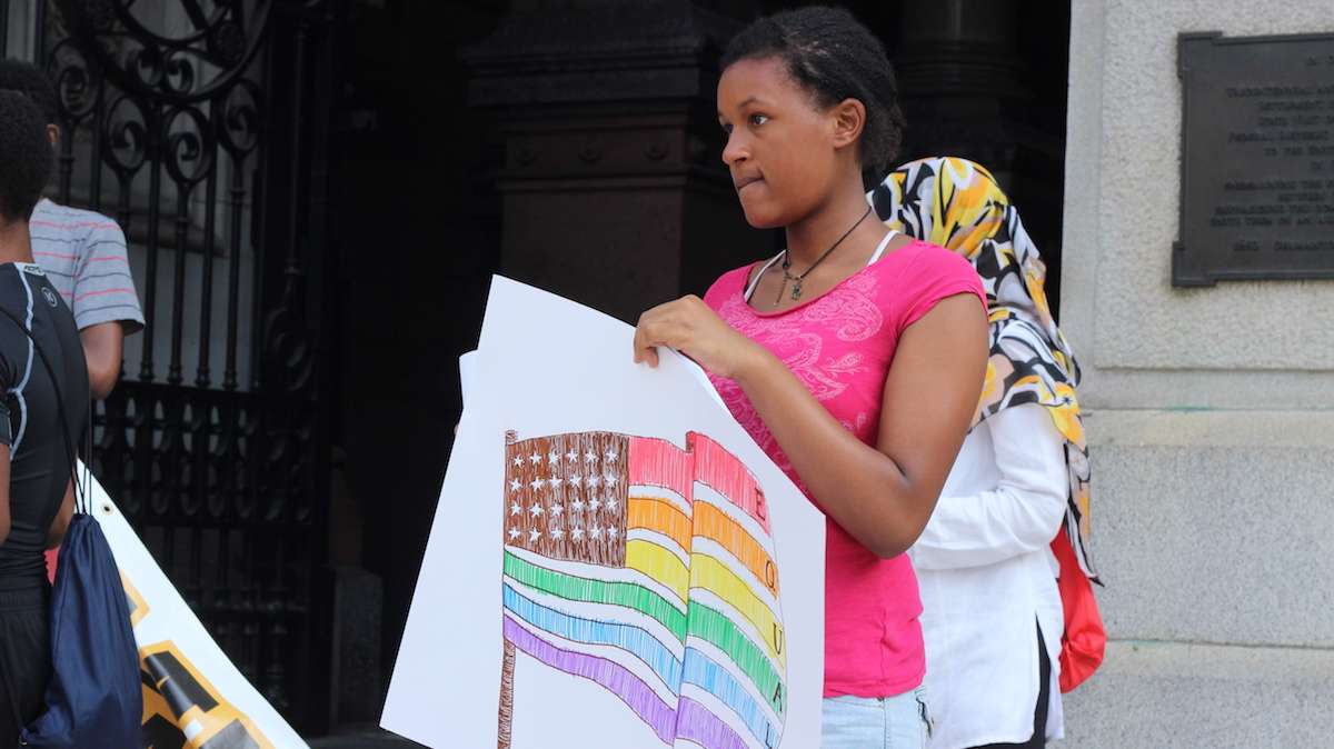 Nia Peterson, 15, read the introduction to the declaration letter as well as a section about the LGBTQ community. (Emily Scott / WHYY)