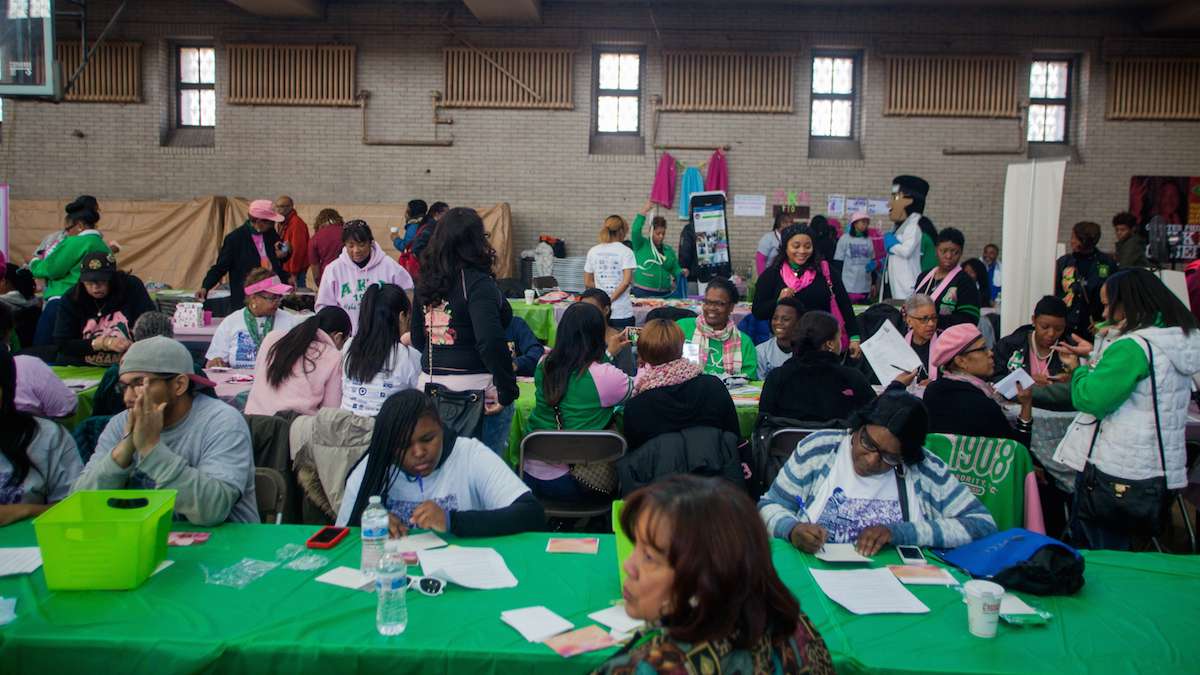 At a job and services fair at Girard College on Martin Luther King Day Philadelphians worked on applying for jobs and writing resumes. (Brad Larrison for NewsWorks)