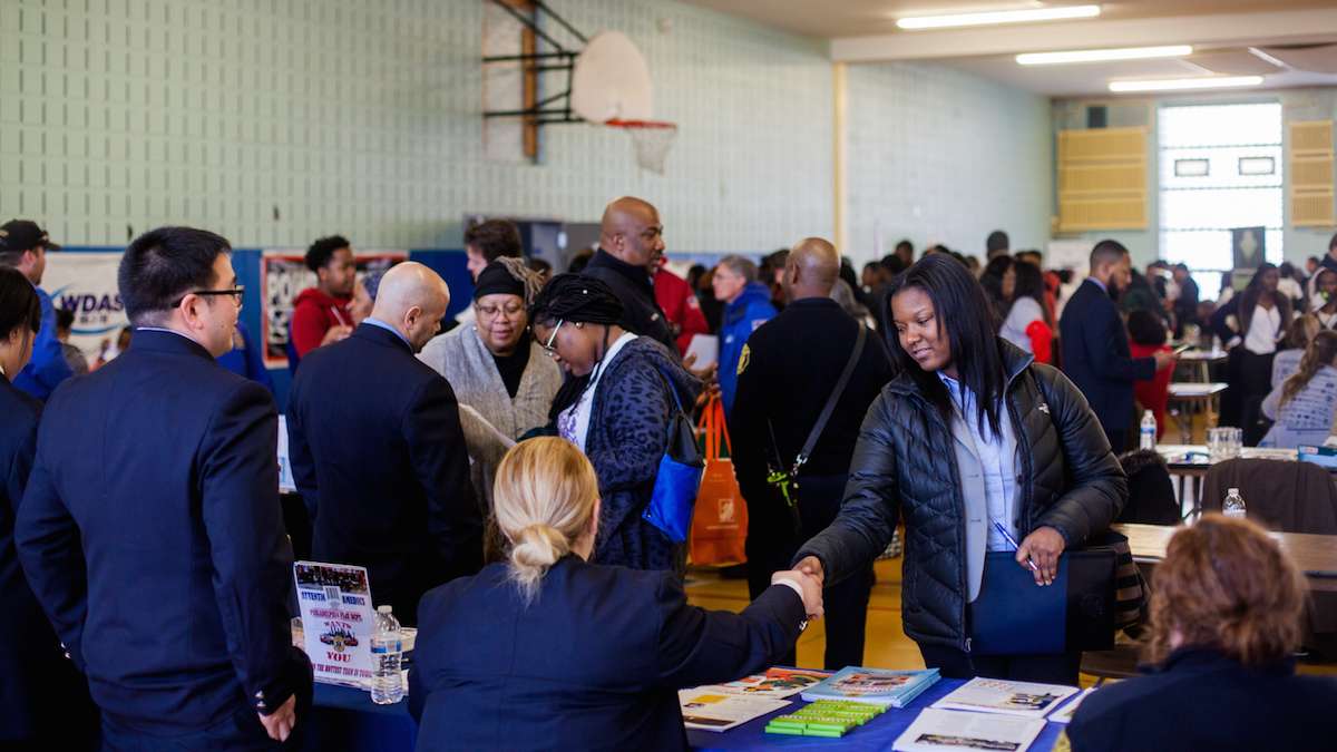 The Philadelphia Fire Department tabled and looked for new recruits at a job and services fair at Girard College on Martin Luther Kind Day. (Brad Larrison for NewsWorks)