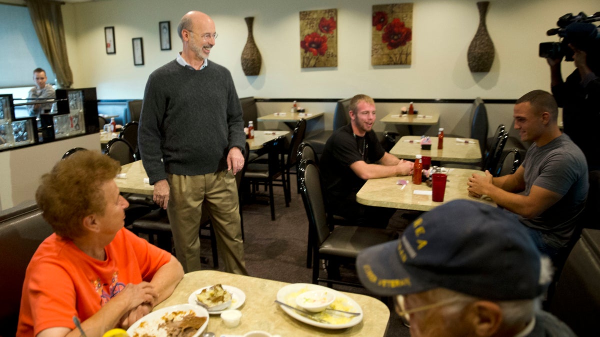  Pennsylvania Democratic Gov.-elect Tom Wolf  greets people at a cafe after winning the gubernatorial election. (AP Photo/Matt Rourke) 