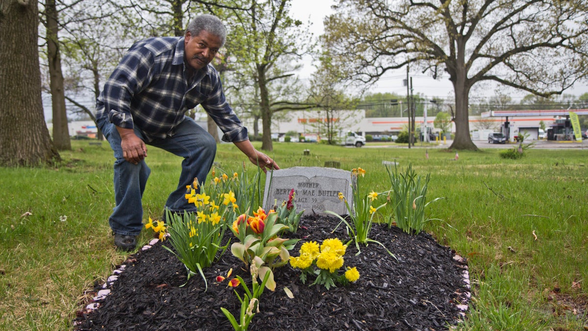 Neil Butler maintains his mother’s grave and often volunteers to help upkeep Mt. Peace Cemetery in Lawnside, N.J. (Kimberly Paynter/WHYY)