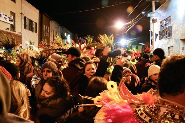 <p><p>Mummers intermingle with revelers as barriers are broken down, literally and figuratively, on narrow 2nd Street in South Philly. (Image courtesy of Kate Devlin)</p></p>

