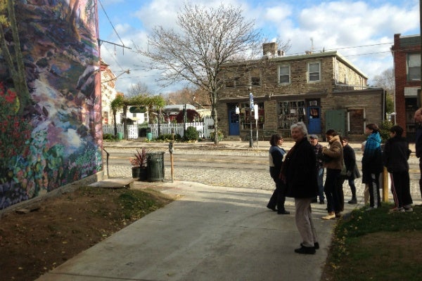 <p><p>Participants check out the recently dedicated "Wissahickon Crossing" mural by Ann Northrup, painted on side of Bredenbeck's Bakery in Chestnut Hill. (Lou Mancinelli/for NewsWorks)</p></p>
