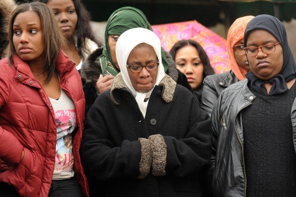 <p><p>Leslie Glenn, Najji's mother, center, stands during prayer with Imani Glenn, left, and Lashawn Brown, Najji's fiancée who is six months pregnant. (Peter Tobia/for NewsWorks)</p></p>
