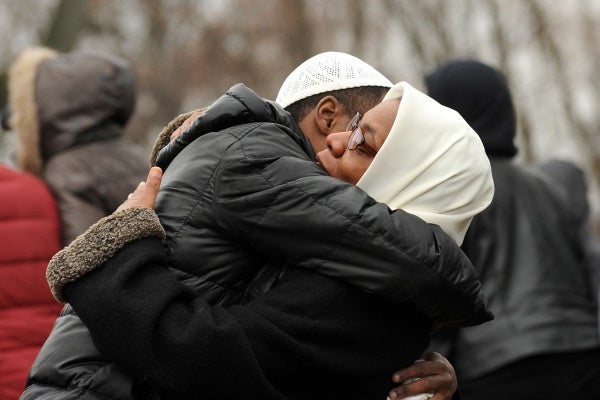 <p><p>A funeral attendee hugs Leslie Glenn, mother of Najji Abdul-Rahim, at the end of the service. (Peter Tobia/for NewsWorks)</p></p>
