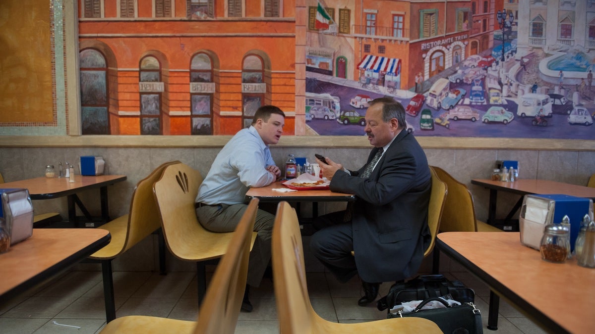 Nelson Diaz and communications director Barry Caro discuss talking points over lunch at Ciao Pizza in center city before a string of evening events on Thursday.