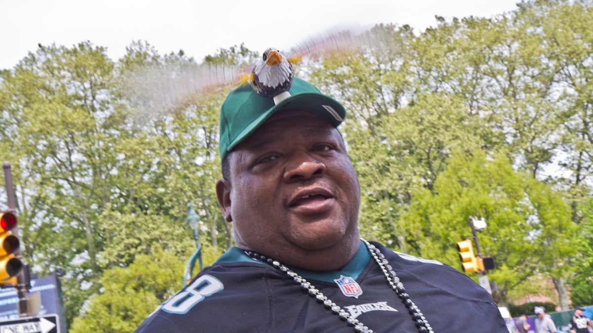 Monty G is a Philadelphia Eagles hype-man and sells flying bird hats. (Kimberly Paynter/WHYY)