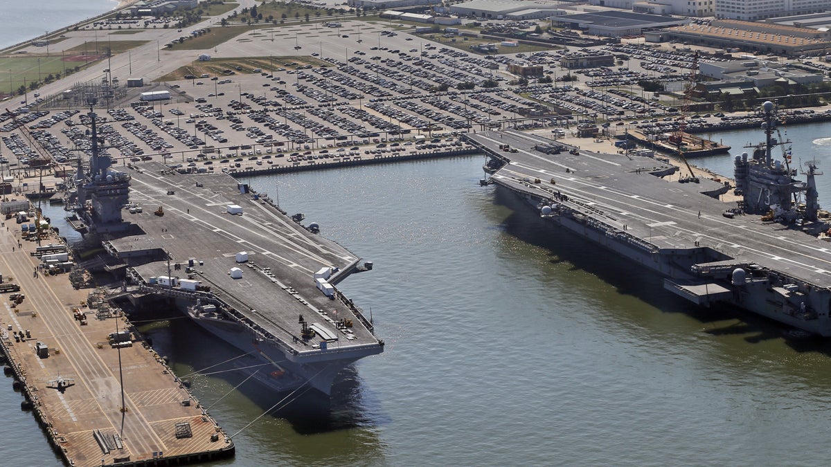 Nuclear-powered aircraft carrier USS Dwight D. Eisenhower, left, and USS George Washington, right, sit pierside at Naval Station Norfolk in Norfolk, Va., Wednesday, April 27, 2016. There is growing consensus among Washington Republicans that climate change is a threat to U.S. security. Norfolk, Virginia, headquarters of the Atlantic fleet, now floods several times a year. (AP Photo/Steve Helber, file) 