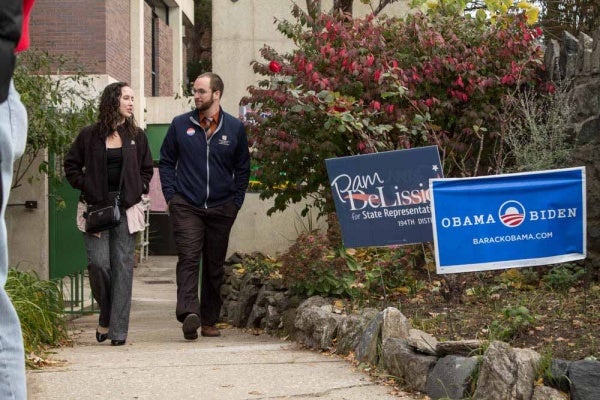 <p><p>A couple walks towards the Roxborough Library to cast their votes in the 2012 General Election. (Francis Hilario/for NewsWorks)</p></p>
