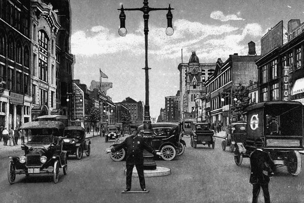 <p><p>A policeman is shown directing traffic on North Broad and Race streets in this 1915 postcard. (Historical image courtesy of Arcadia Publishing.)</p></p>
