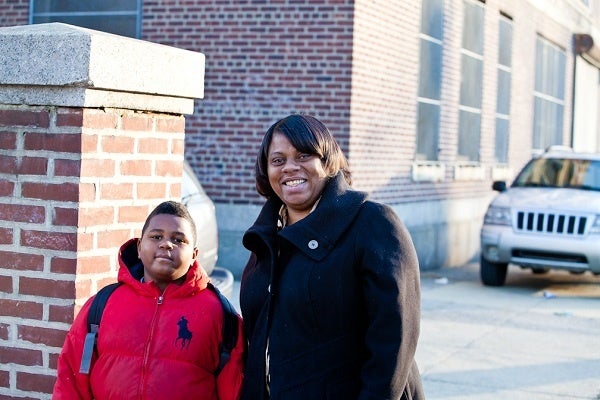 <p><p>Elvita Williams and her son, second grader Shakur Lewis, outside of John L. Kinsey Elementary West Oak Lane. (Brad Larrison/for NewsWorks)</p></p>

