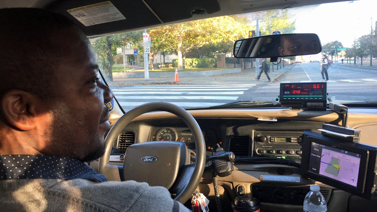  Taxi driver Baba Tunde is making more than twice as much as usual since SEPTA workers went on strike.(Bobby Allyn/WHYY) 