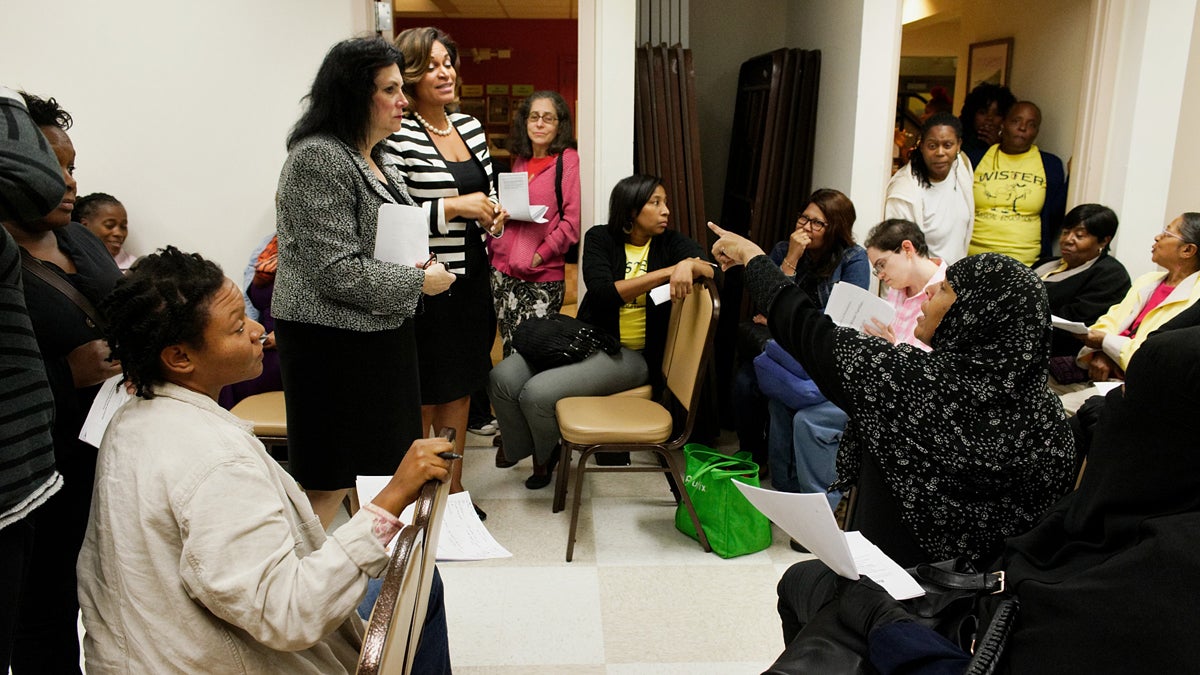  Members of the Wister Elementary School community hear a pitch from district staffers on a proposed charter conversion at an October meeting in Germantown. (Bastiaan Slabbers/for NewsWorks) 