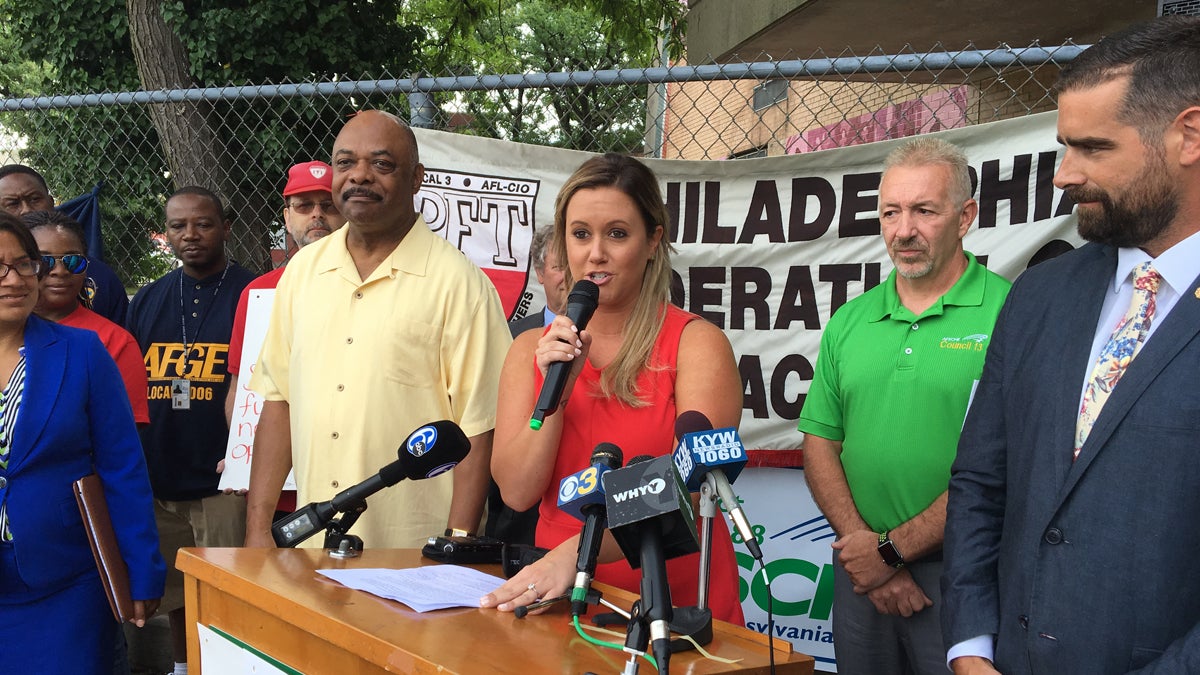  Fifth-grade teacher Angela Masceri joins Philadelphia Federation of Teachers President Jerry Jordan (left) in urging Pennsylvania passage of a natural gas extraction tax. (Dave Davies/WHYY) 