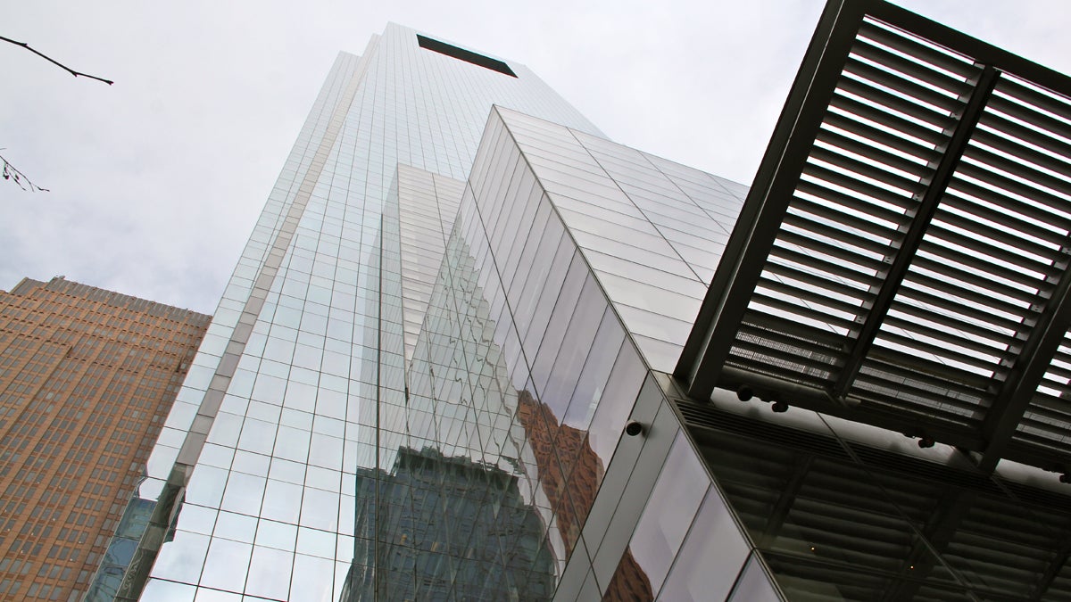 Hulking grey mirrored tower against a grey sky