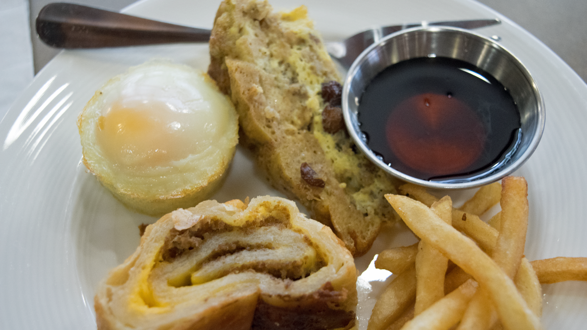  A sampling of Thrive Dining foods available at the Logan Square Watermark Retirement Community, include cheese steak,baked egg, a French toast casserole and fries (Liz Tung for WHYY) 