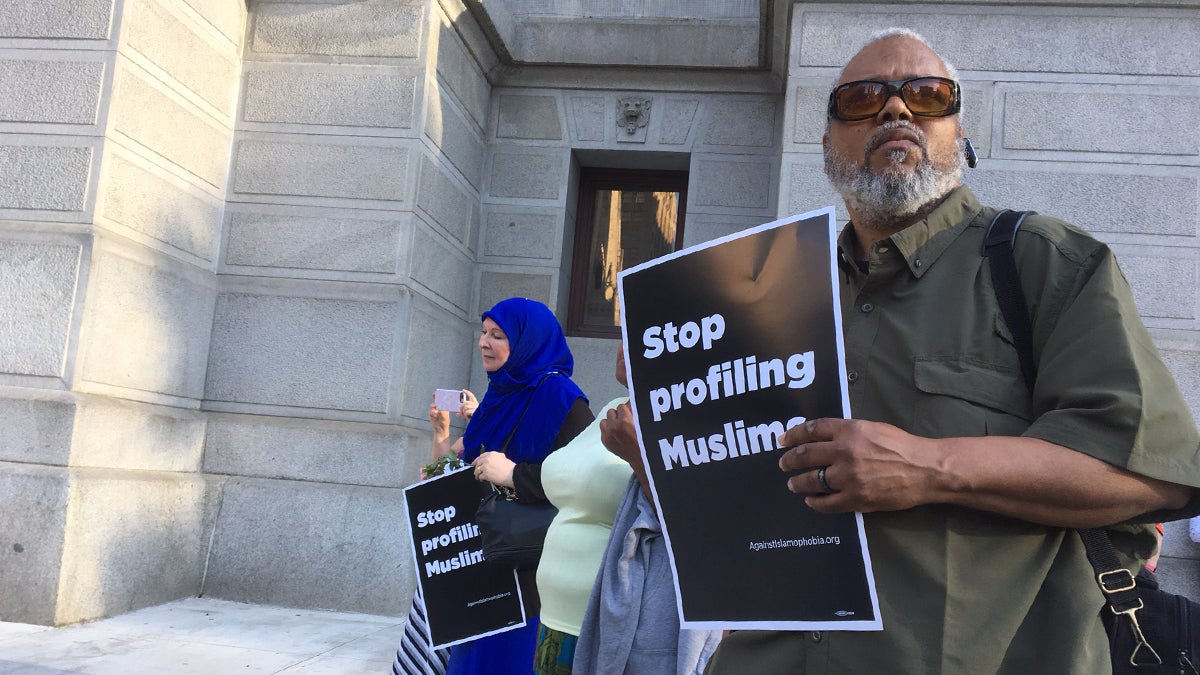  Community members pay hold signs saying 'Justice for Nabra' and 'Stop Profiling Muslims' during a candlelight vigil held in Philadelphia for Nabra Hassanen, the 17-year-old Muslim woman from Sterling, Va., who was beaten to death with a baseball bat early on June 18. (Danielle Fox for NewsWorks) 