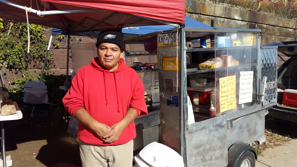  Gerardo Flores stands in front of his taco truck on Allegheny Avenue in North Philadelphia. Formerly in the country illegally, Flores became a permanent resident in 2016. (Laura Benshoff/WHYY) 