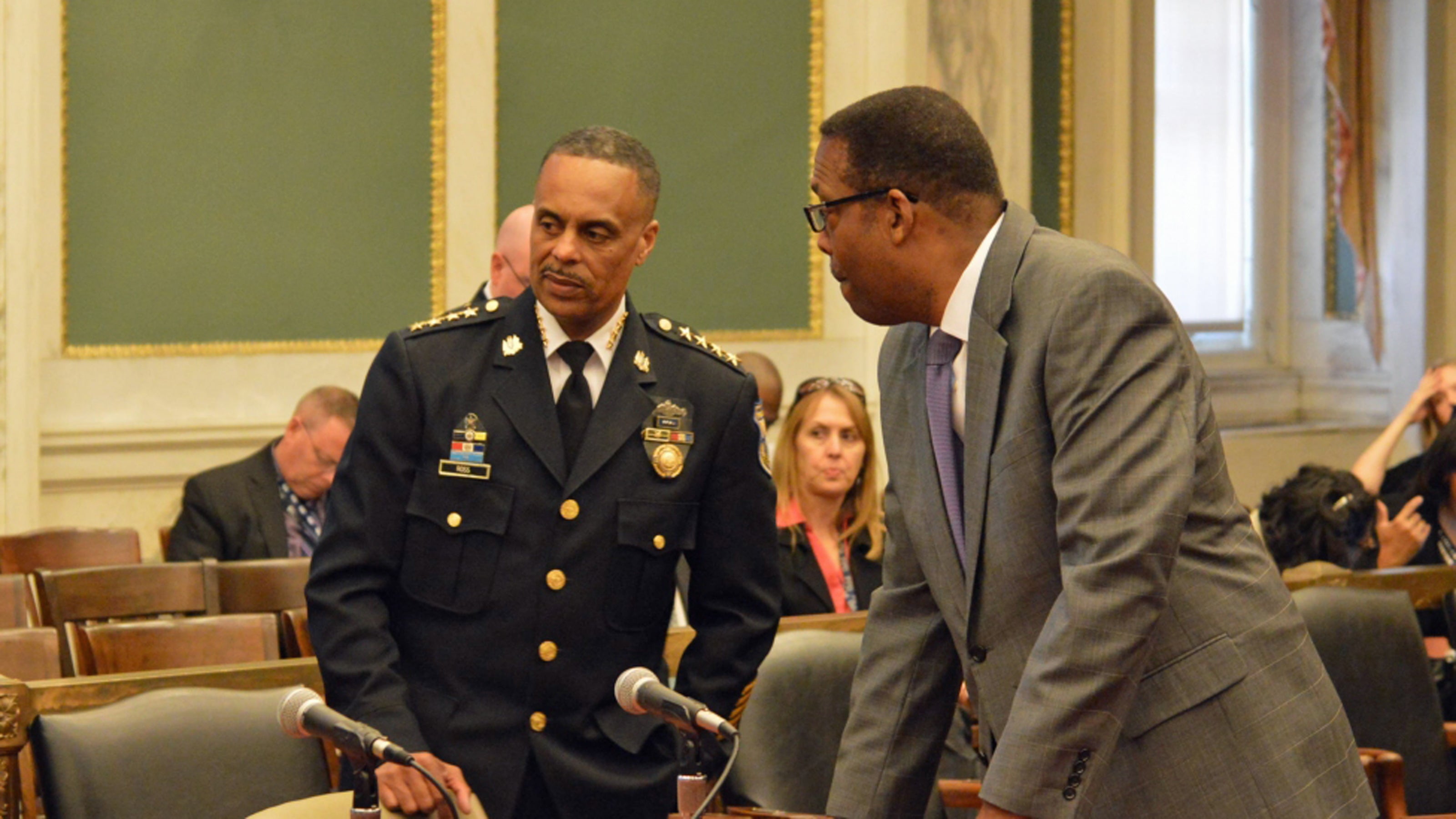  Philadelphia Police Commissioner Richard Ross (left) and  Council President Darrell Clarke speak before a Tuesday budget hearing. (Tom MacDonald/WHYY) 