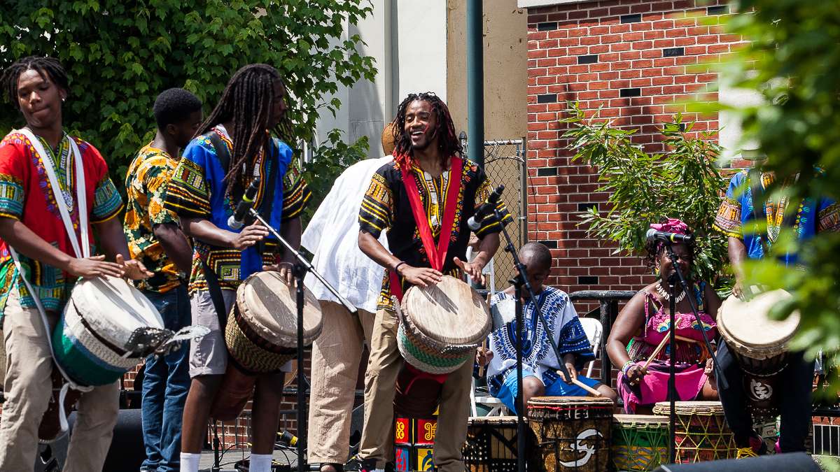 The African Heritage group from Washington, D.C., plays a traditional drum call during the Odunde Festival. Founded by Melvin Deal (not pictured) the group has performed at every Odunde Festival with varying members throughout the years. (Brad Larrison/for NewsWorks)