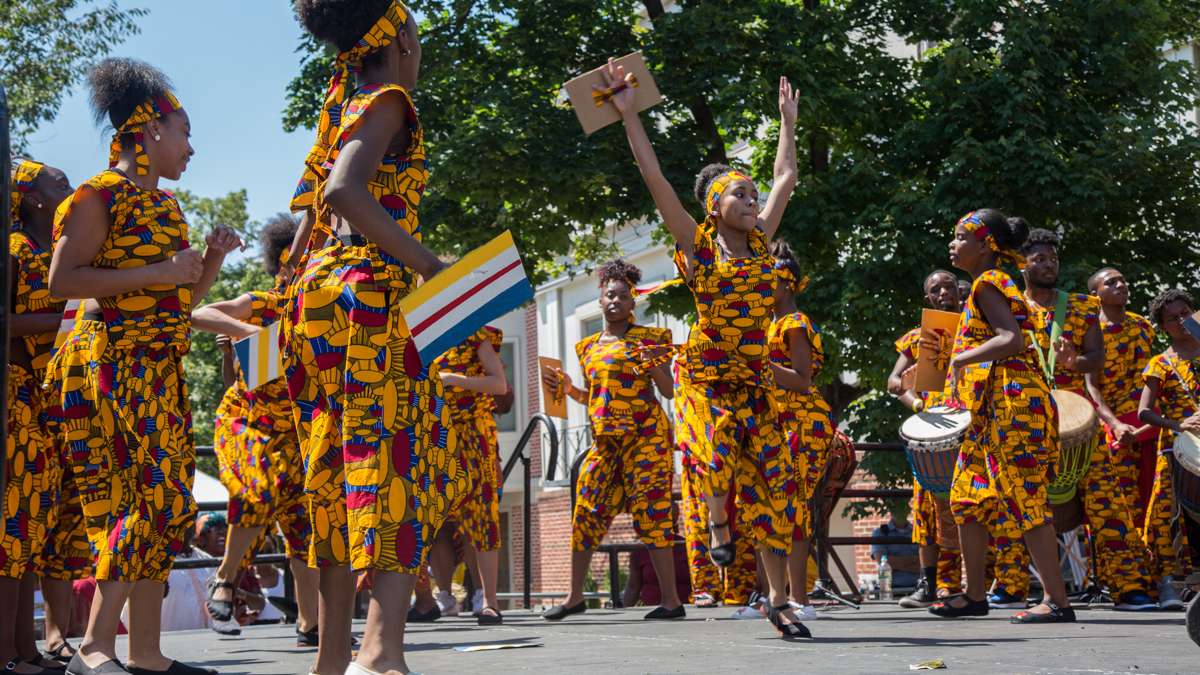 African Heritage Dancers and Drummers dance and play during the 42nd Annual Odunde Festival in Philadelphia. The dance group has performed at every festival since 1975.