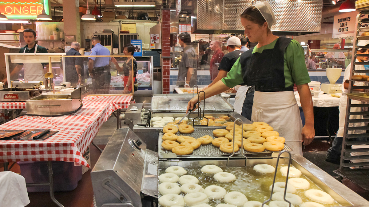  Mim Miller fries donuts at the annual Pennsylvania Dutch Festival at the Reading Terminal Market in Philadelphia. The festival runs through August 10. (Kimberly Paynter/WHYY 