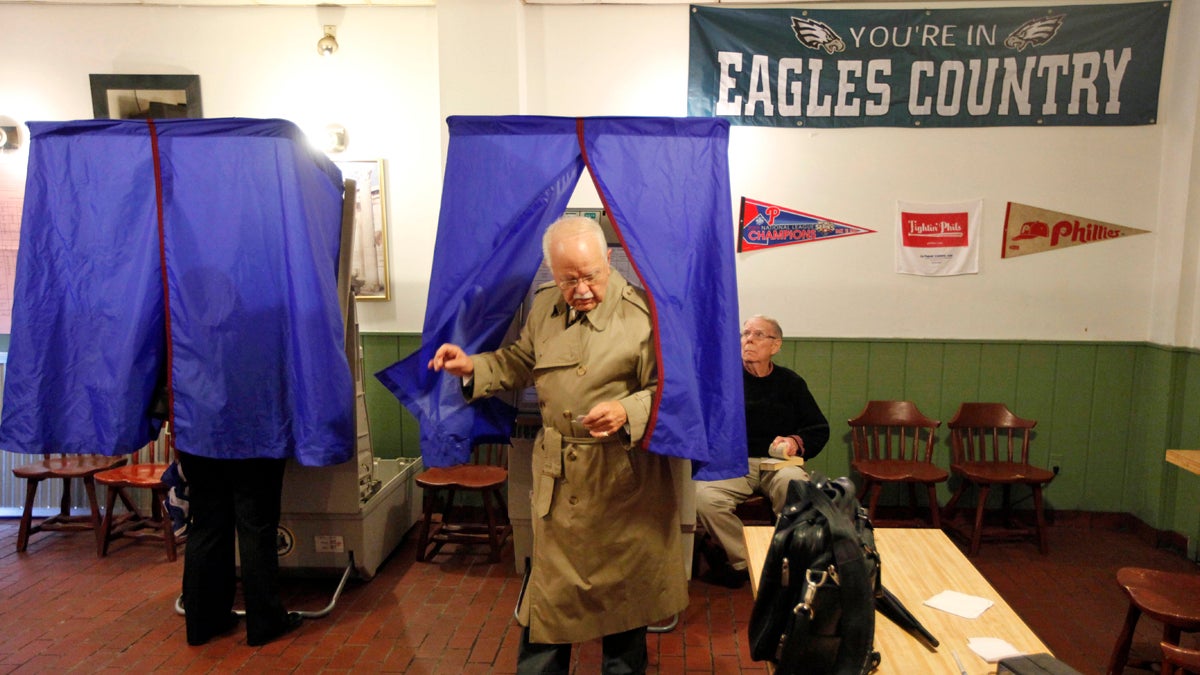 A voter steps out of the voting booth at a polling station in Philadelphia. (AP Photo/Matt Rourke, file) 