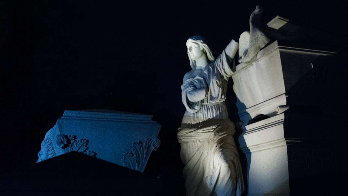 One of the cemetery's most noted sites is the Warner Monument, here illuminated with painted light. The monument was the work of Philadelphia sculptor Alexander Milne Calder, who also created the statue of William Penn that stands atop Philadelphia City Hall.