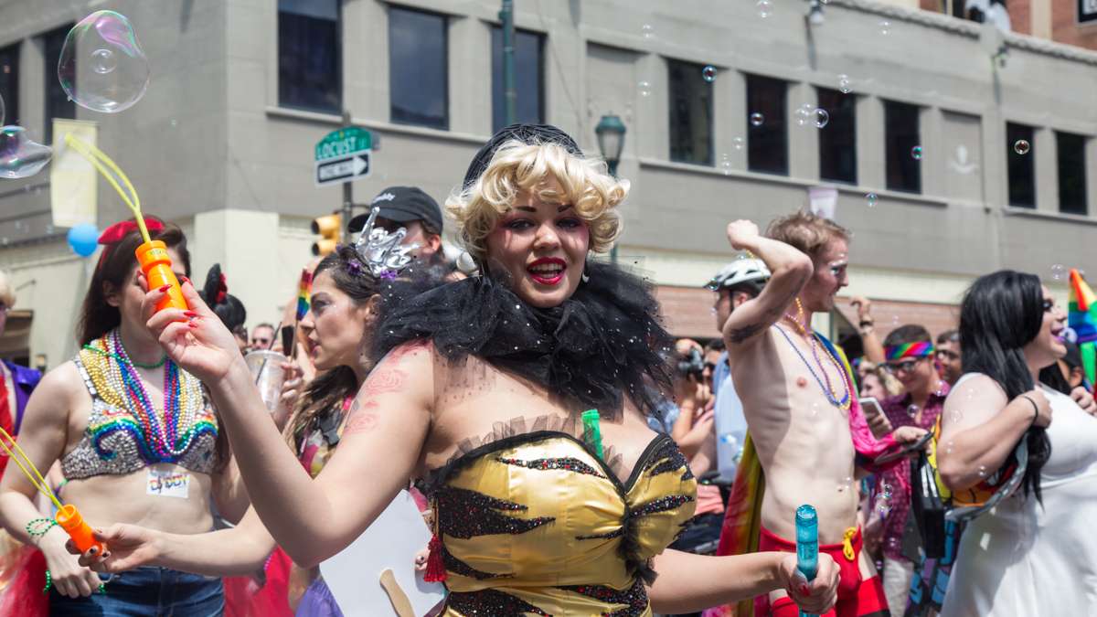 A marcher blows bubbles at the 2017 Philadelphia Pride Parade, Sunday, June 18, 2017.