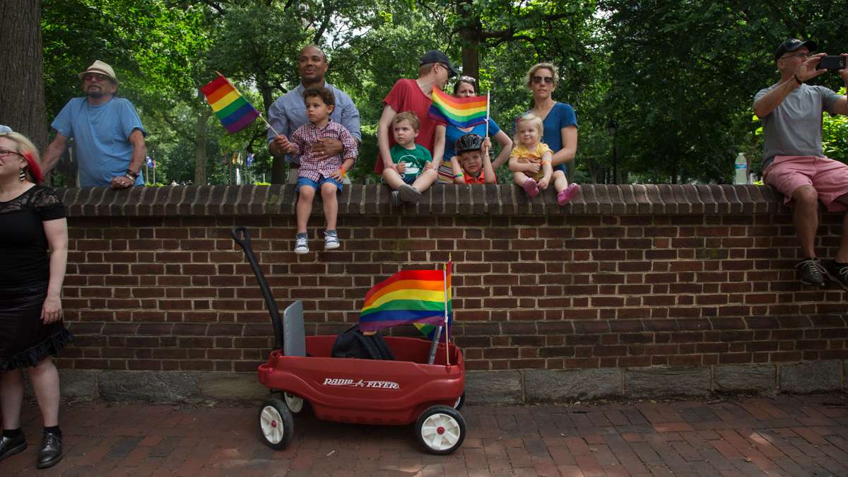 Families gather to watch the Philadelphia Pride Parade Sunday, June18, 2017.