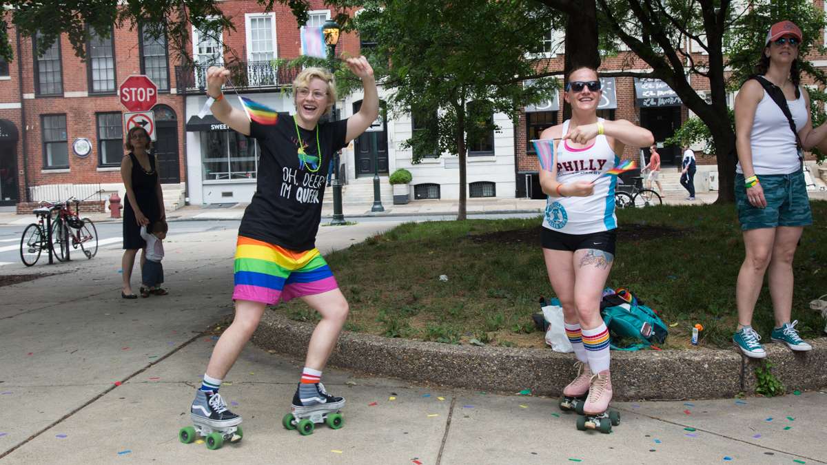 Emily Erdman, 26, and Mandi Marino, 33, skate alongside the 2017 Philadelphia Pride Parade with their Philly Roller Derby team, Sunday, June 18, 2017.