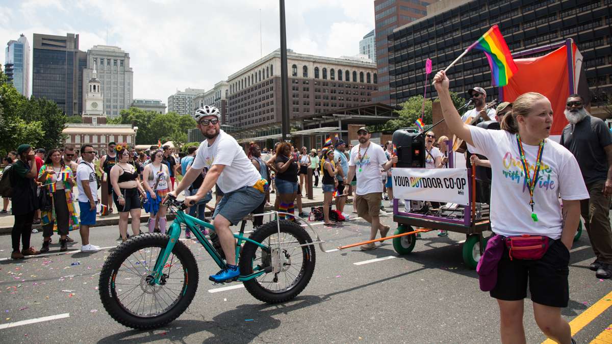 REI store manager Barry Cohen (center) built the company's float with his father, Richard, who walked with friends and other REI co-op members at the 2017 Philadelphia Pride Parade, Sunday, June 18, 2017.