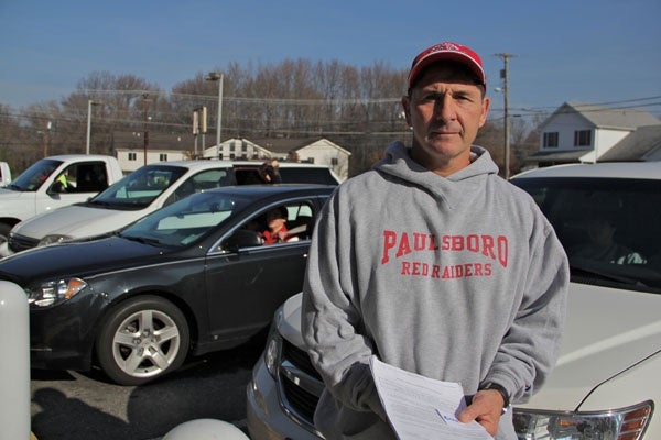 <p>With schools closed because of a chemical spill, Paulsboro High School principal and wrestling coach Paul Morina organizes a practice in Gibbstown. (Emma Lee/for NewsWorks)</p>
