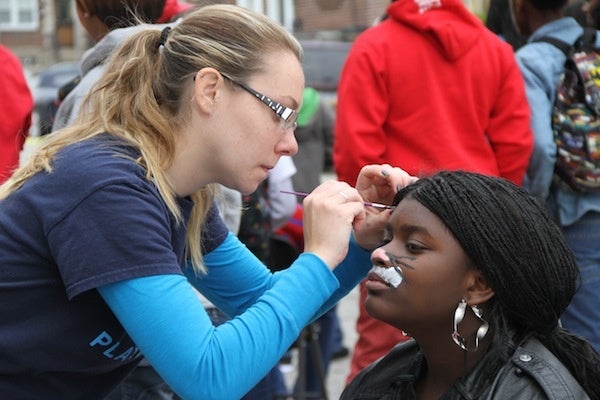 <p><p>Volunteers paint faces at the fall festival. (Trenae V. McDuffie/for NewsWorks)</p></p>
