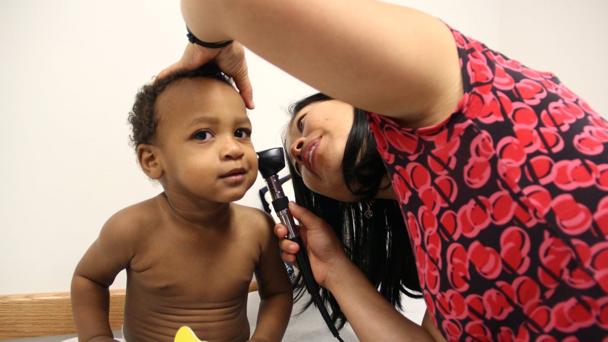 Keith Patrick, 17 months, gets a checkup from Dr. Elena Huang at Karabots Pediatric Care Center. The American Academy of Pediatrics now recommends that physicians screen all children for food insecurity. (Emma Lee/WHYY) 
