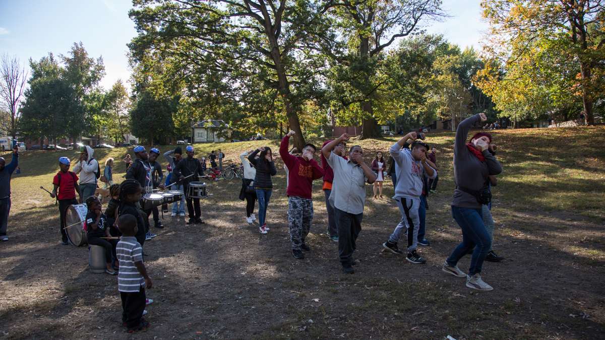 Marchers dance at Clark Park at the end of the 17th annual Peoplehood parade, Oct. 29, 2016.