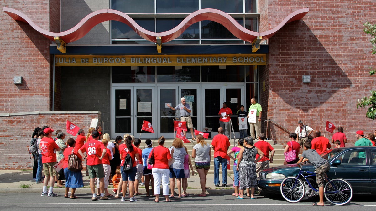  A rally at DeBurgos Elementary School draws about 60 parents, students and educators. The rally is the first of several that the teachers' union plans to hold at different neighborhood schools throughout the city. (Emma Lee/for NewsWorks) 