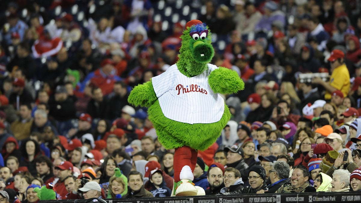  The Phillie Phanatic struts across the roof of the Phillies dugout during an April 2013 game against the Pittsburgh Pirates. (AP Photo/Michael Perez, file) 