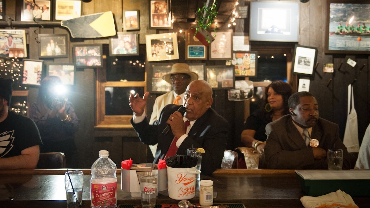 Mayoral candidate Milton Street answers a question from a patron at Billy Murphy's Irish Saloon Tuesday night, during its weekly quizzo event. Questions focused on public schools, his position on charters, and why he is running for mayor.
