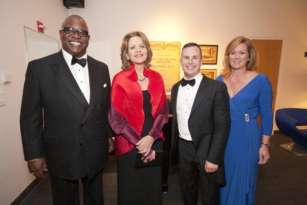 <p><p>Yannick Nezet-Seguin (center) shares a post-concert moment with soprano Renee Fleming and Opening Night Co-chairs Osagie Imasogie (left) and Priscilla Holmes (Photo courtesy of Jessica Griffin)</p></p>
