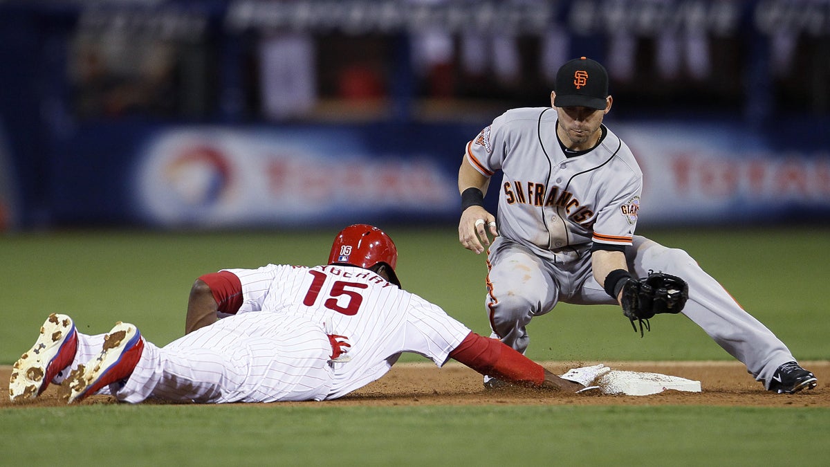  Philadelphia Phillies' John Mayberry, left, dives back to second base where San Francisco Giants' Marco Scutaro is waiting on a pick-off attempt during the seventh inning of a baseball game Tuesday, July 30, 2013, in Philadelphia. Mayberry made it back safely. The Phillies won 7-3. (AP Photo/Tom Mihalek) 